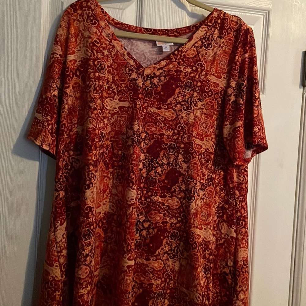 LuLaRoe XL Jana hi/lo empire waist swing top orange print . Never Worn No tags